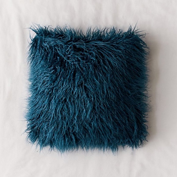 teal furry pillow
